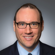 headshot of Jed Stiglitz on gray background